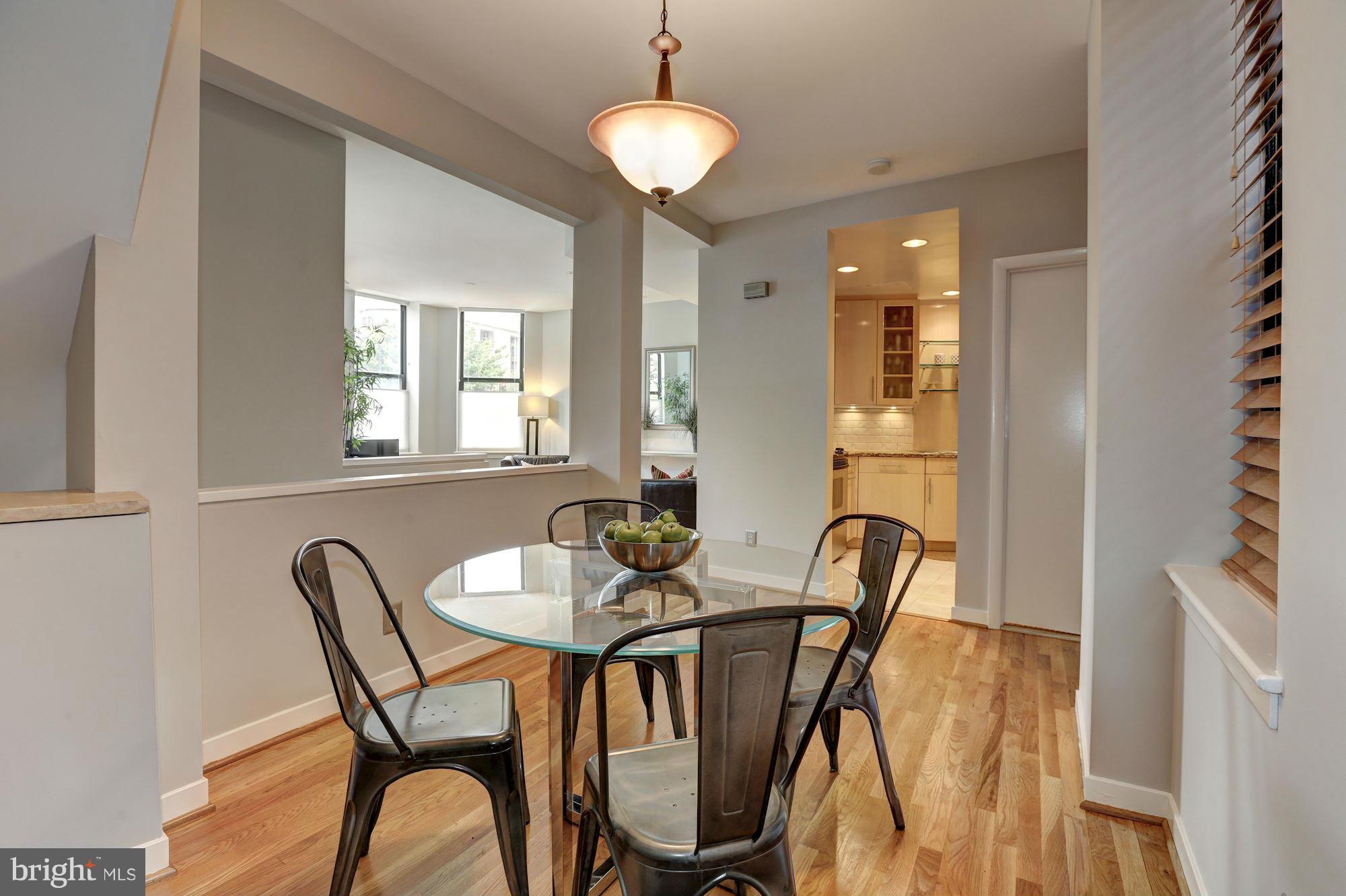 3 Washington Circle Northwest, Unit 103 Washington, DC 20037 - Photo 7 of 28 a view of a dining room with furniture and chandelier