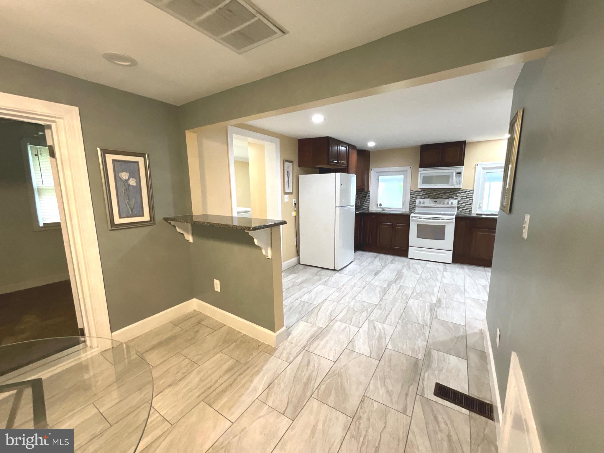 86 Kelley Road Fredericksburg, VA 22405 - Photo 12 of 36 a view of a kitchen with wooden floor and a kitchen