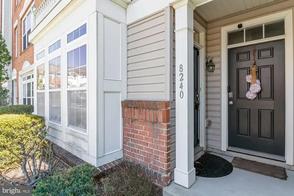 a view of porch with a door and wooden floor
