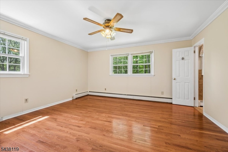 335 Drakestown Road Long Valley, NJ 07853 - Photo 17 of 34 a view of an empty room with wooden floor and a window
