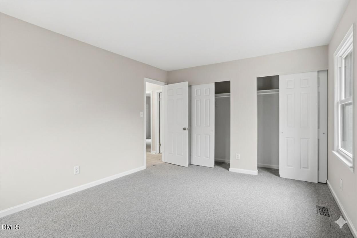 3457 Hope Valley Road Durham, NC 27707 - Photo 18 of 24 an empty room with closet area