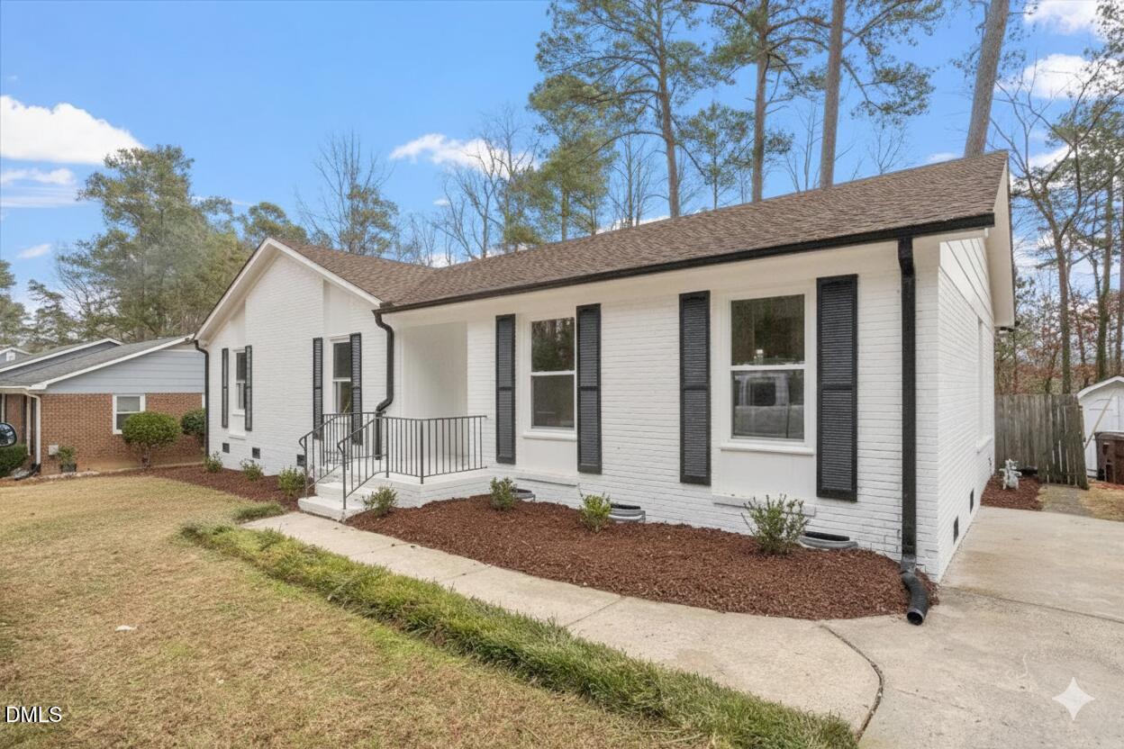3457 Hope Valley Road Durham, NC 27707 - Photo 20 of 24 a front view of a house with a yard and outdoor seating