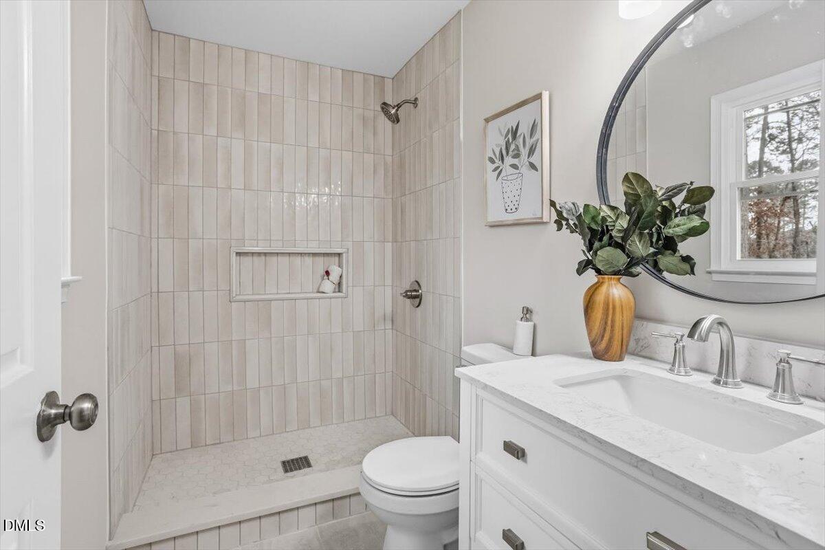 3457 Hope Valley Road Durham, NC 27707 - Photo 8 of 24 a bathroom with a granite countertop sink a toilet and shower