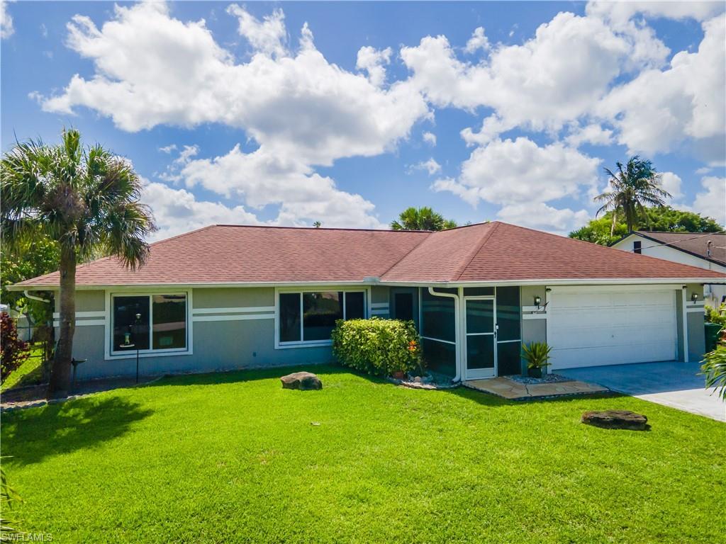 2100 55th Street Southwest Naples, FL 34116 - Photo 2 of 50 a view of a house with a garden