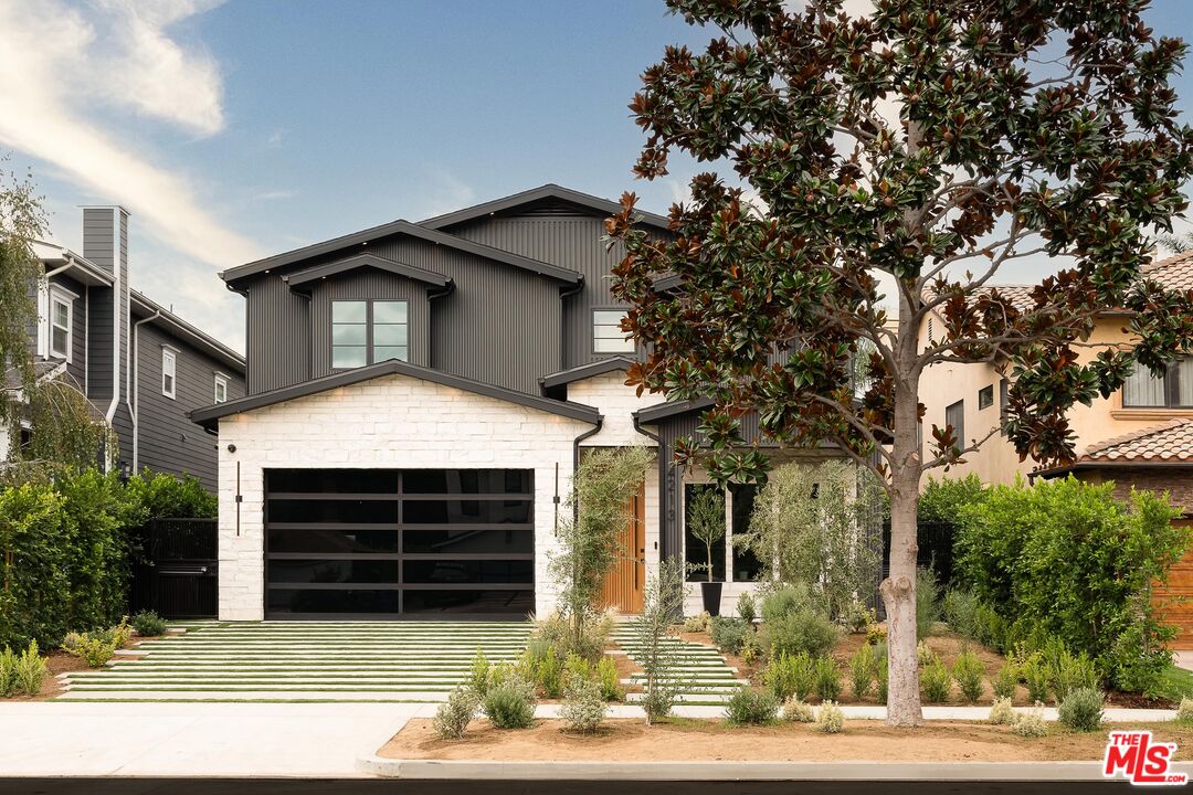4213 Rhodes Avenue Studio City, CA 91604 - Photo 1 of 1 a front view of a house with garage