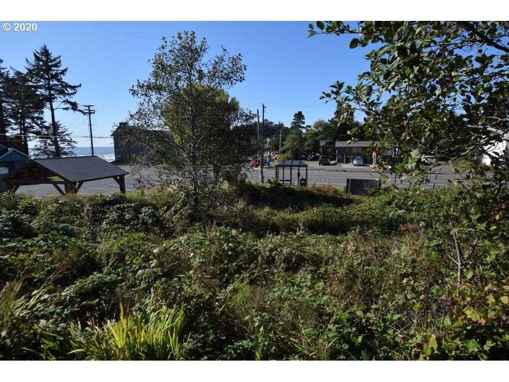 400 Highway 101 Yachats, OR 97498 - Photo 2 of 4 a aerial view of a house with a yard