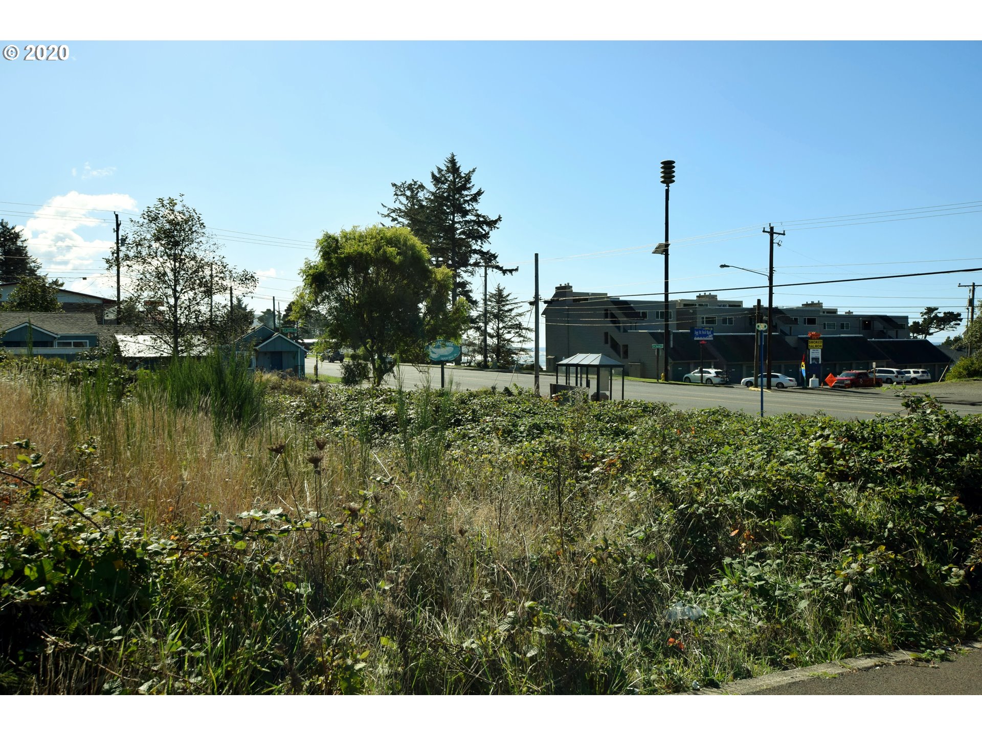400 Highway 101 Yachats, OR 97498 - Photo 3 of 4 a view of a garden with a lake