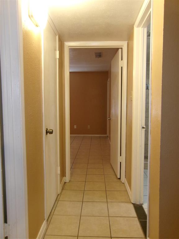 1201 Independence Trail Grand Prairie, TX 75052 - Photo 12 of 24 a view of a hallway with a door and a bathroom