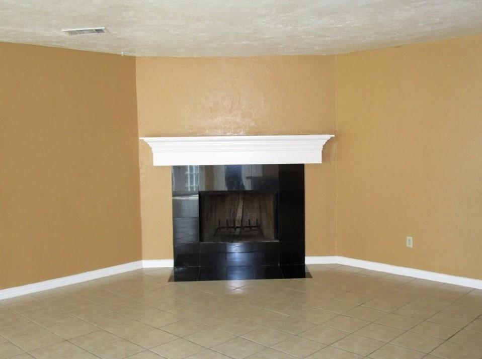 1201 Independence Trail Grand Prairie, TX 75052 - Photo 5 of 24 a view of an empty room with a fireplace