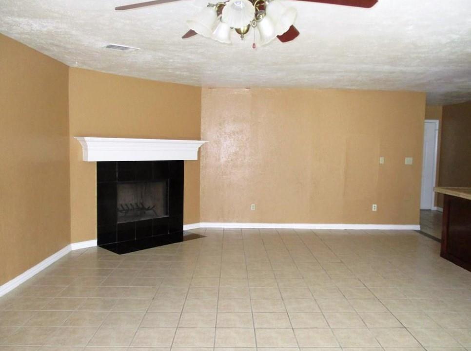 1201 Independence Trail Grand Prairie, TX 75052 - Photo 6 of 24 a view of an empty room with a fireplace