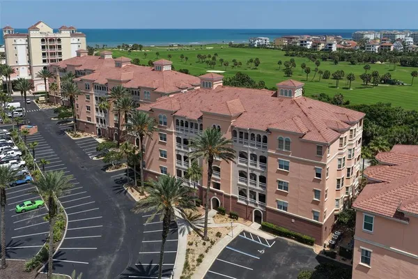 an aerial view of multiple houses with yard