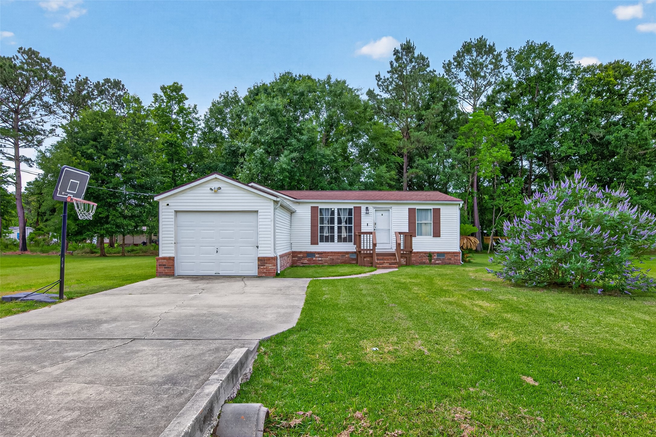 16572 River Ranch Drive Conroe, TX 77302 - Photo 3 of 18 a front view of a house with yard