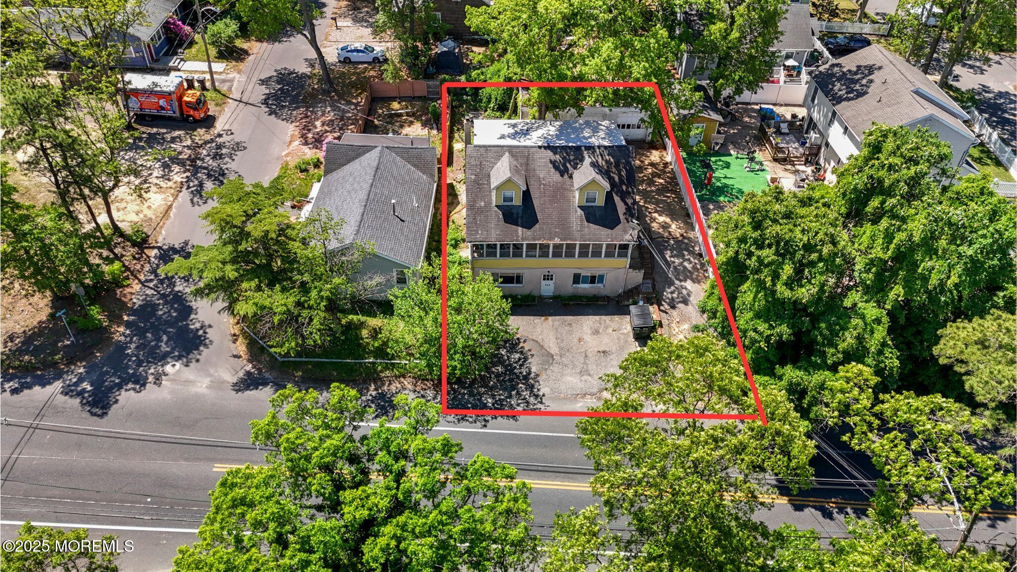 849 Mantoloking Road Brick, NJ 08723 - Photo 2 of 10 a view of swimming pool with outdoor seating and trees