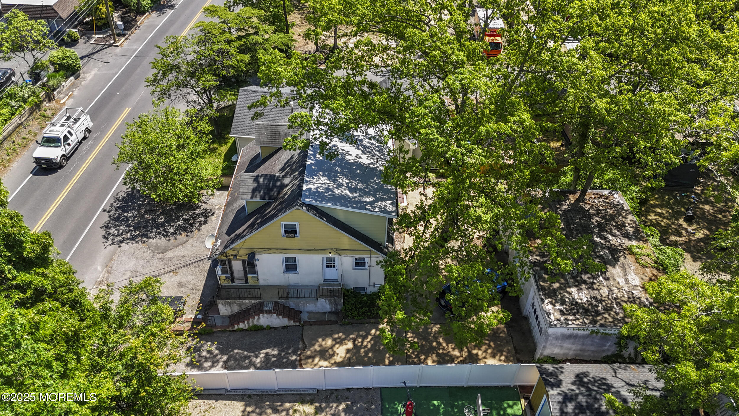 849 Mantoloking Road Brick, NJ 08723 - Photo 3 of 10 a view of a house with a tree in the background