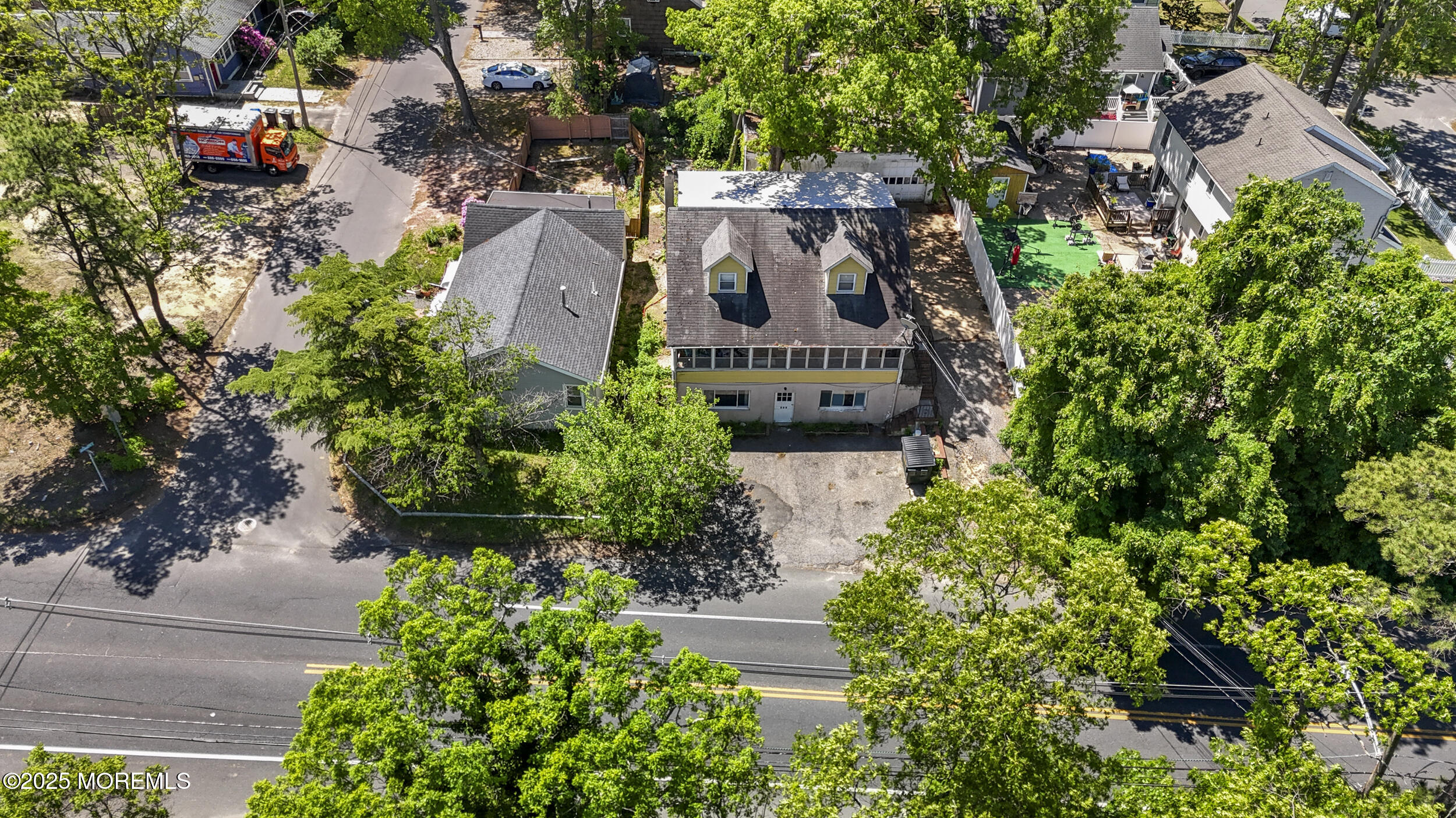 849 Mantoloking Road Brick, NJ 08723 - Photo 4 of 10 an aerial view of a house with garden space and street view
