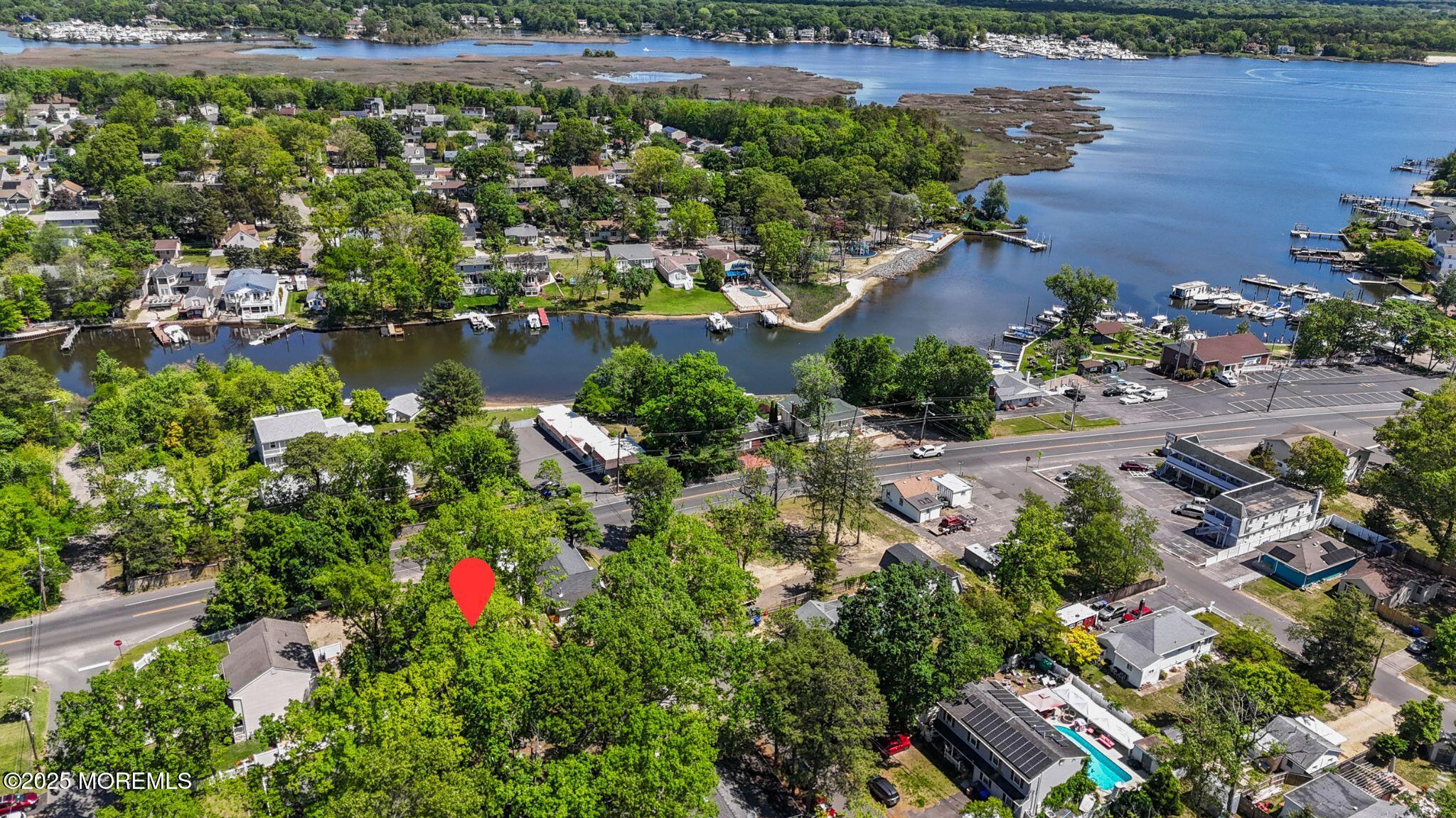 849 Mantoloking Road Brick, NJ 08723 - Photo 6 of 10 an aerial view of a house with a lake view