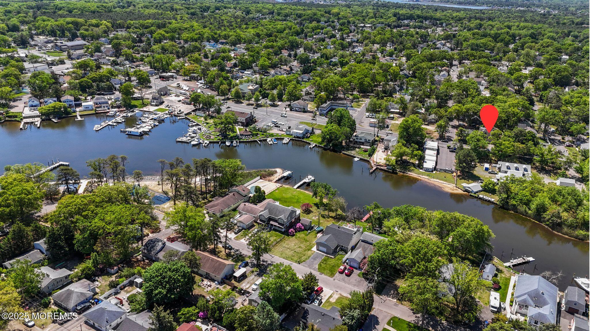 849 Mantoloking Road Brick, NJ 08723 - Photo 9 of 10 an aerial view of a houses with a yard and lake view