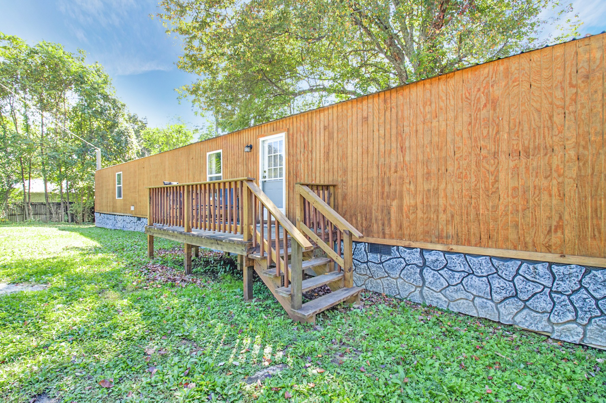131 Maynard Avenue Jamestown, TN 38556 - Photo 11 of 59 a view of a backyard with a small cabin and a chair