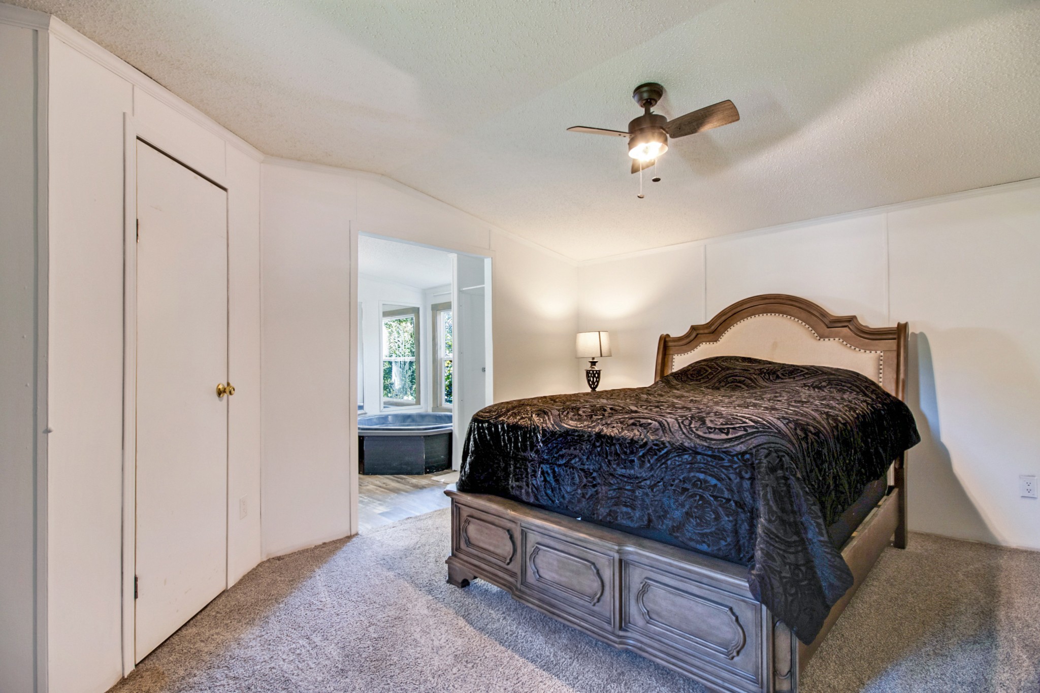 131 Maynard Avenue Jamestown, TN 38556 - Photo 25 of 59 a spacious bedroom with a bed and a ceiling fan