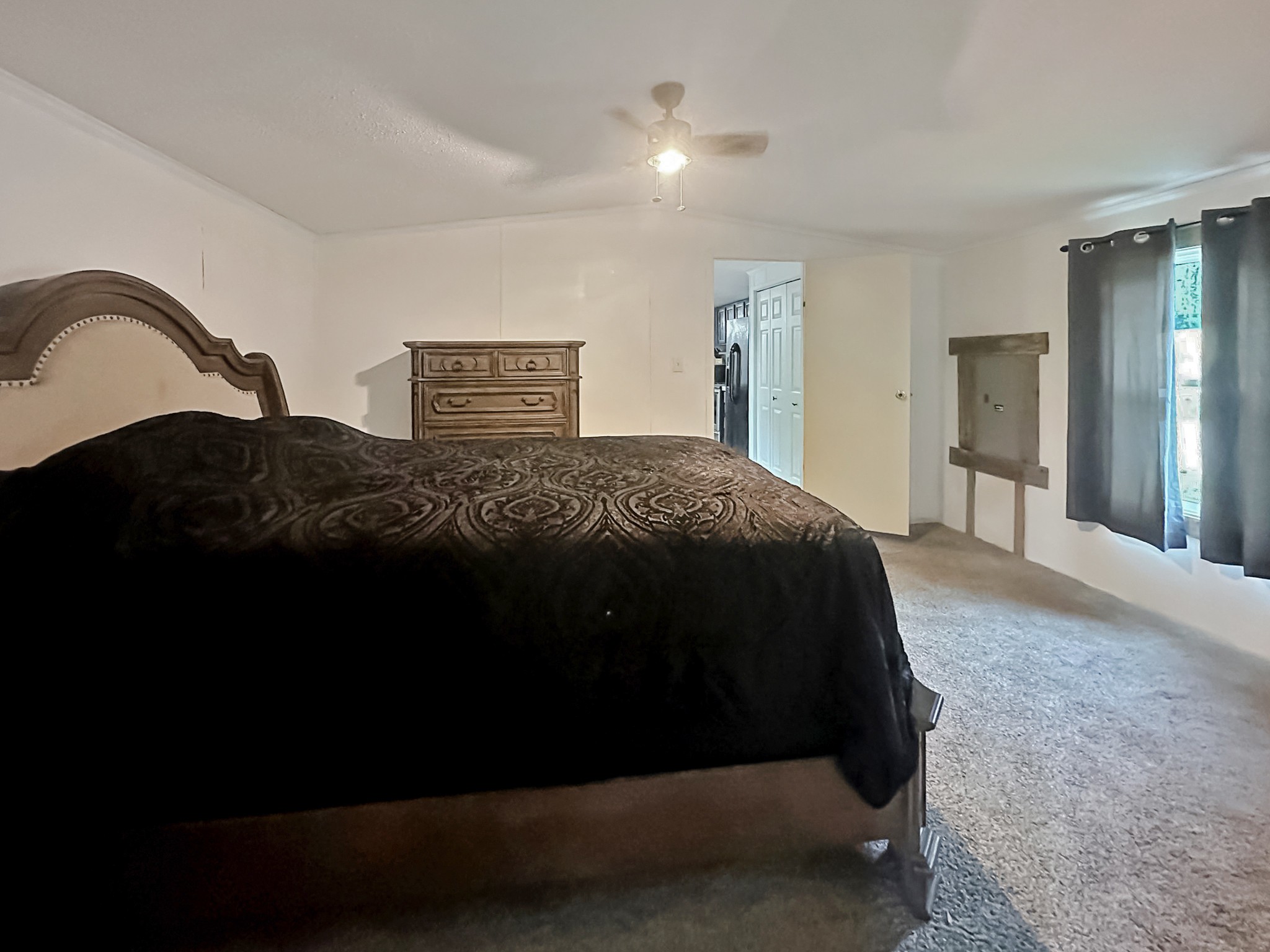 131 Maynard Avenue Jamestown, TN 38556 - Photo 8 of 59 a spacious bedroom with a bed and a dresser