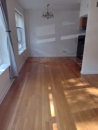 a view of an empty room with a window