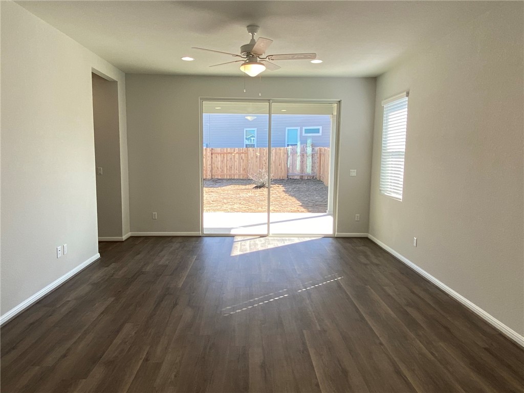 384 Gaida Loop Georgetown, TX 78628 - Photo 7 of 20 Extra tall sliding doors invite the natural light while enticing your guest outside to enjoy the covered patio.