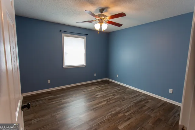 a bathroom with a tub a sink and mirrors