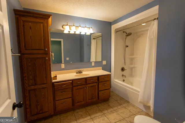 a kitchen with a refrigerator and a stove