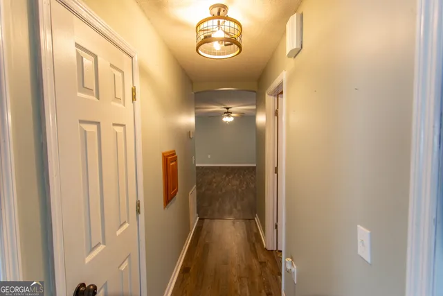 an aerial view of a house with a yard and lake view