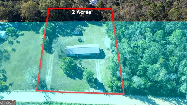 a view of a back yard of the house and a garden