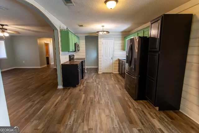 a kitchen sink with granite countertop