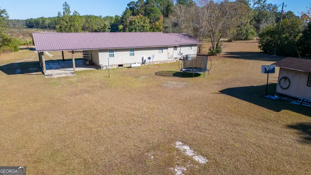a view of a brick house with a deck