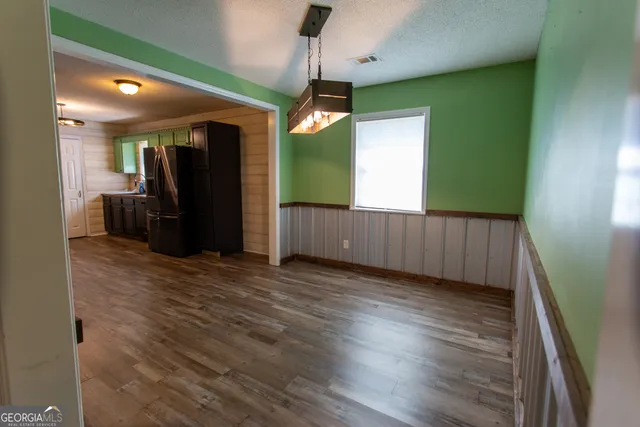 a view of a livingroom with wooden floor