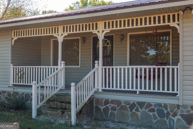 a view of a brick house with a large window