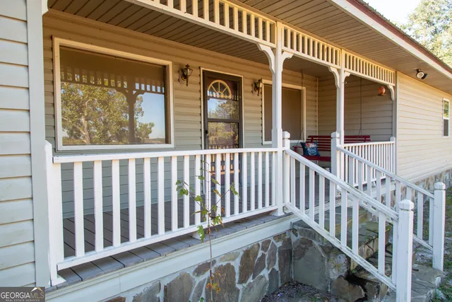 a view of a balcony with wooden floor