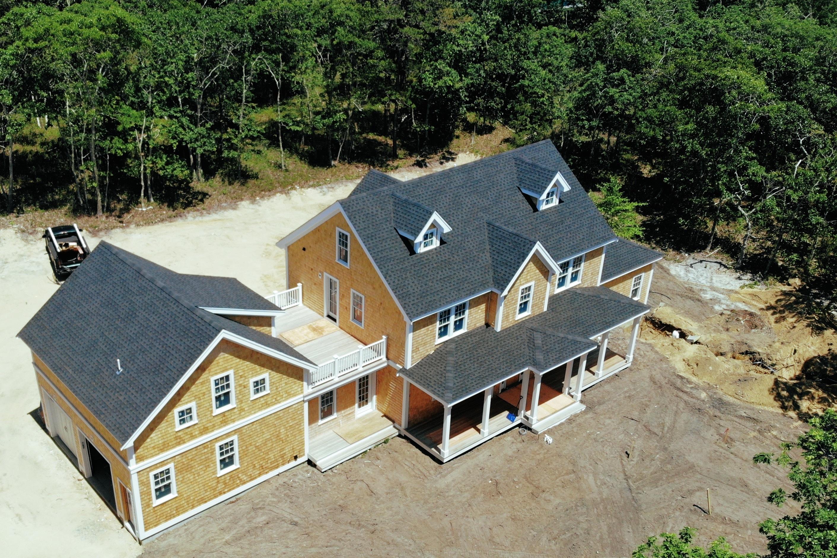 18 Paddock Road Oak Bluffs, MA 02557 - Photo 1 of 7 an aerial view of a house with a yard and trees