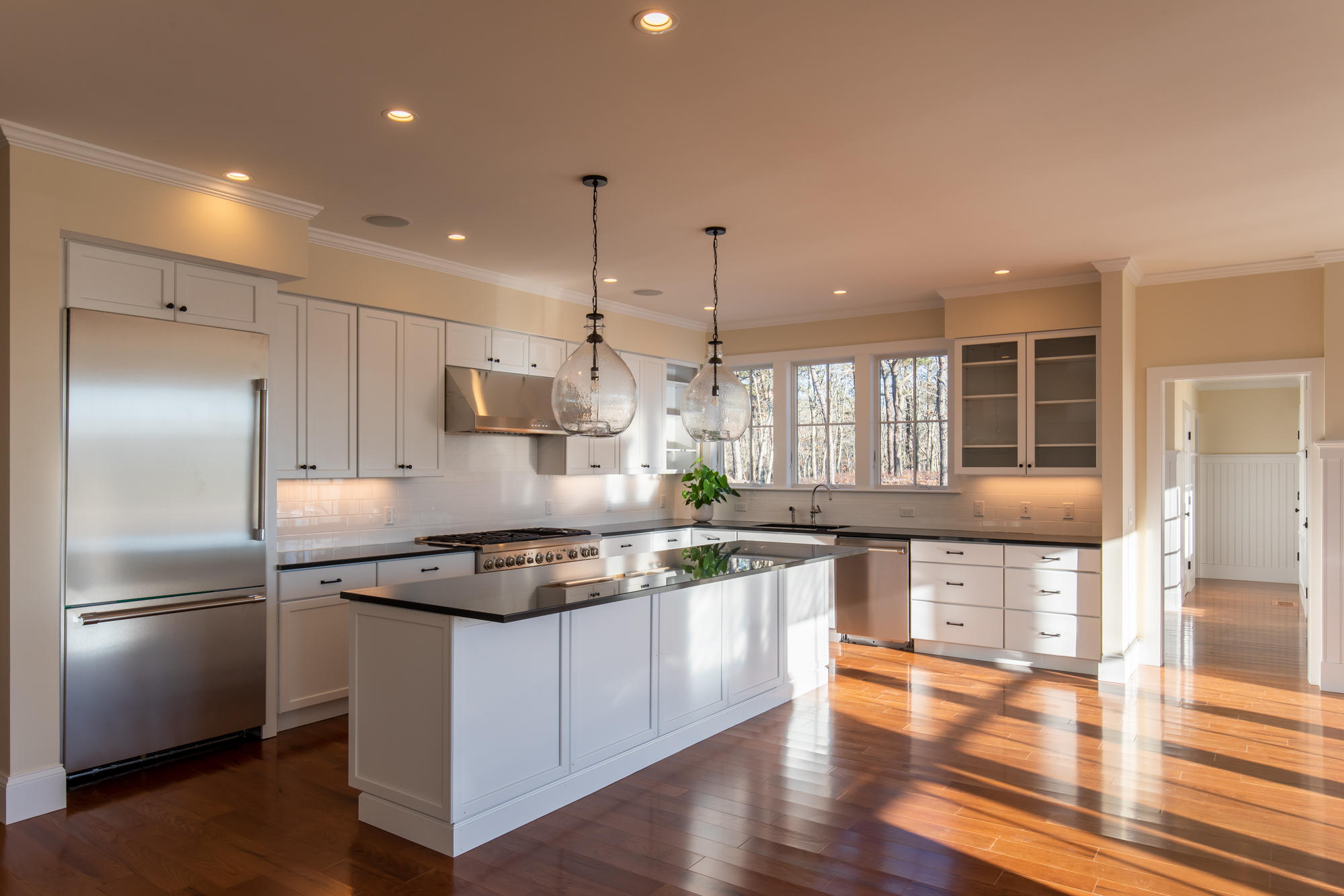 18 Paddock Road Oak Bluffs, MA 02557 - Photo 5 of 7 a kitchen with stainless steel appliances granite countertop a refrigerator a stove and a wooden floors