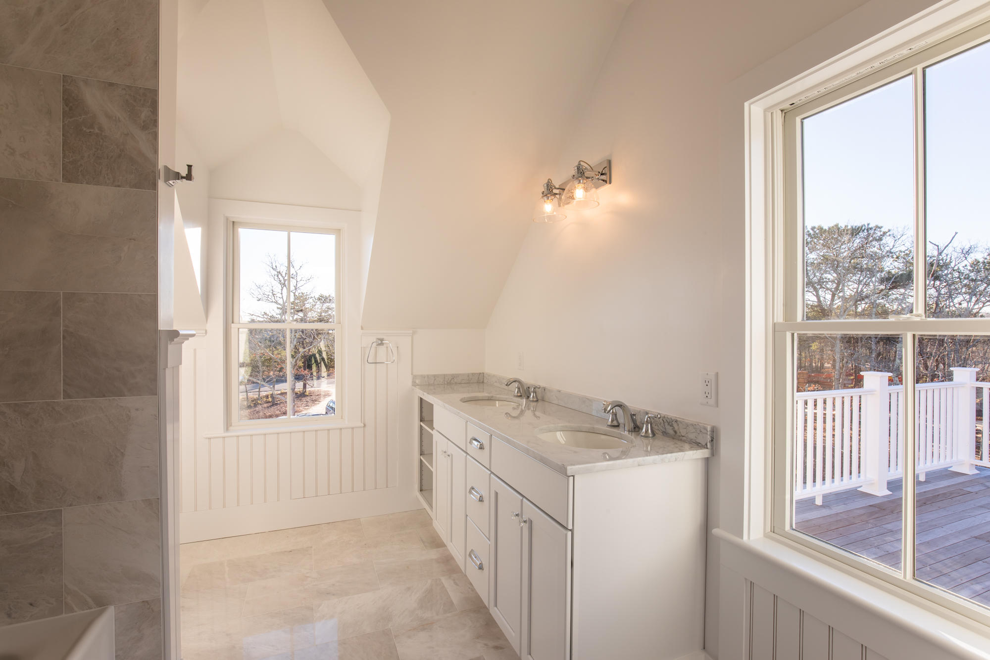 18 Paddock Road Oak Bluffs, MA 02557 - Photo 7 of 7 a bathroom with a granite countertop sink and a window