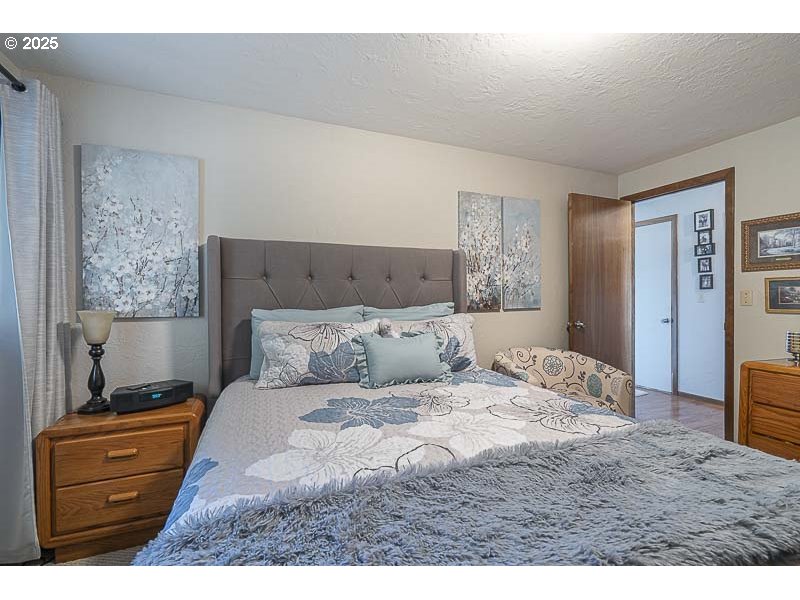 11660 Simpson Road Monmouth, OR 97361 - Photo 22 of 43 a bedroom with a bed and a dresser