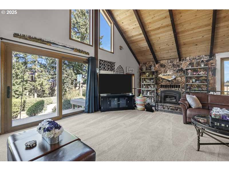 11660 Simpson Road Monmouth, OR 97361 - Photo 3 of 43 a living room with furniture a flat screen tv and a fireplace