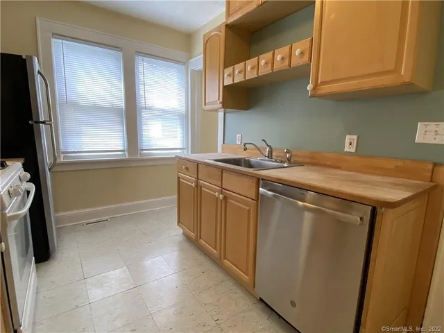 a utility room with a sink a washer and dryer