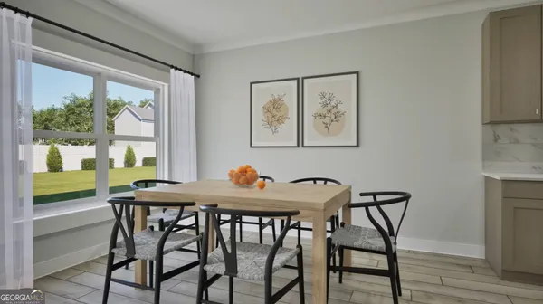 a view of a dining room with furniture large window and wooden floor