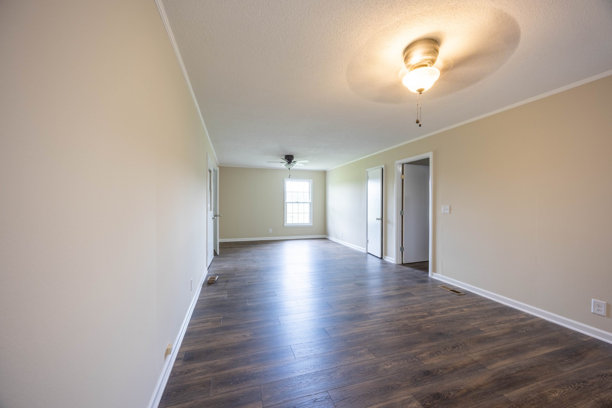 1229 Knights Church Road Decherd, TN 37324 - Photo 4 of 18 wooden floor in an empty room with a window
