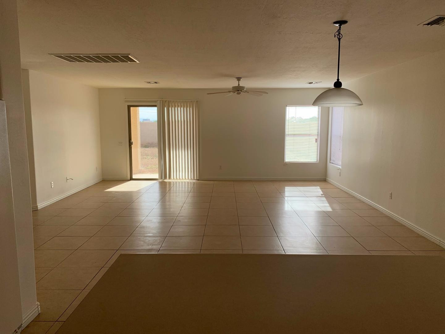 43589 West Cowpath Road Maricopa, AZ 85138 - Photo 4 of 6 a view of a room with window wooden floor and windows