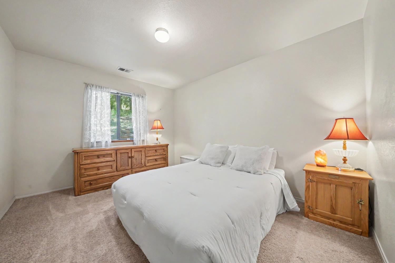20310 State Rte 26 West Point, CA 95255 - Photo 28 of 57 a bedroom with a bed and a window