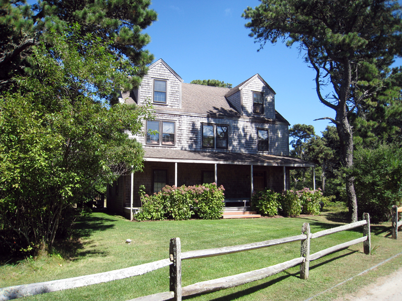 94 Miacomet Road Nantucket, MA 02554 - Photo 17 of 18 a front view of a house with a yard