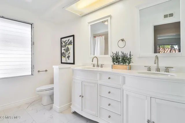 a view of a house with backyard porch and sitting area