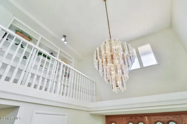 a view of a kitchen with wooden floor and a kitchen