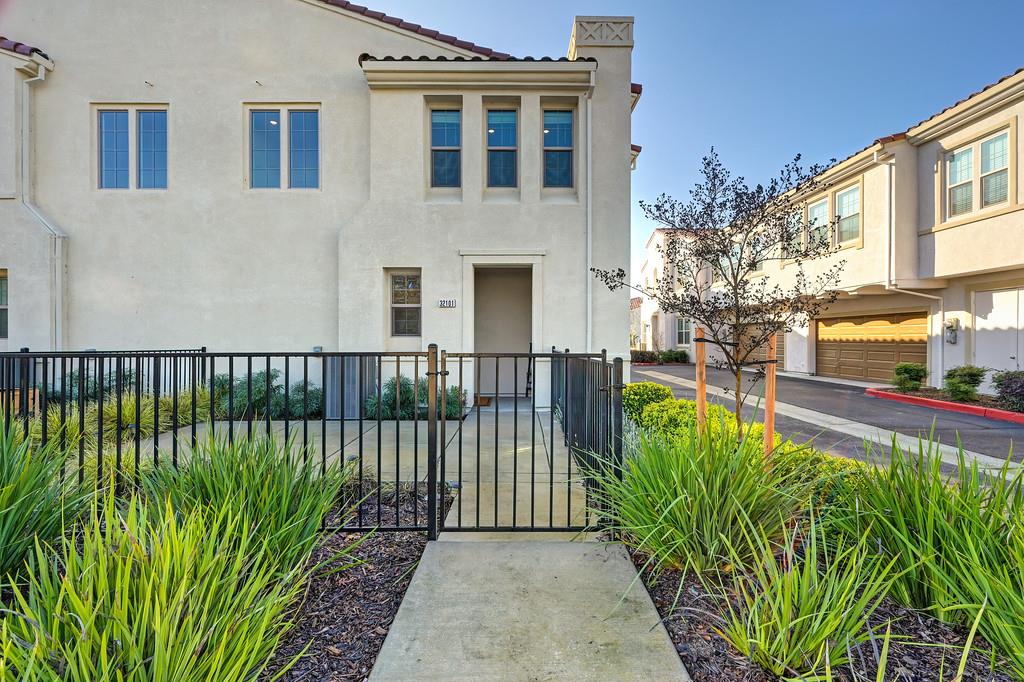 a view of a house with a small yard