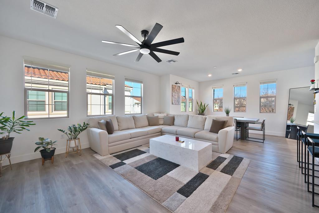 5301 East Commerce Way, Unit 32101 Sacramento, CA 95835 - Photo 16 of 41 a living room with furniture and a large window
